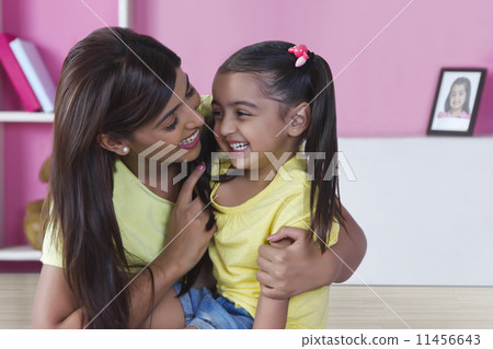 Happy mother and daughter spending leisure time at home 11456643