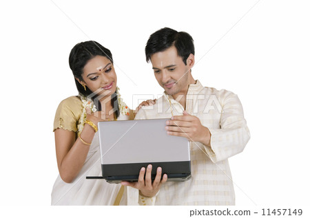 South Indian couple with a laptop 11457149