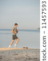 Man running beach 11457593