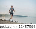 Man running beach 11457594
