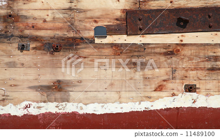 Old wooden ship fragment, hull under renovation, background phot 11489100