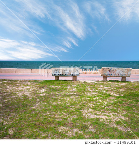 Two stone benches on the coast of Persian Gulf in Saudi Arabia 11489101
