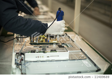 Manual worker at production line 11489689