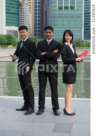 A team of Three successful young asian colleagues of difference ethnic background standing tall v2 11490928