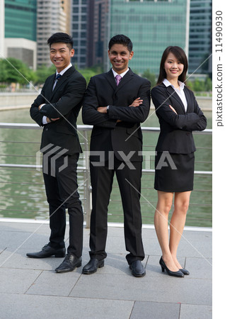 A team of Three successful young asian colleagues of difference ethnic background standing tall v4 11490930