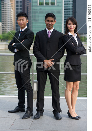 A team of Three successful young asian colleague of difference ethnic background standing tall v5 11490931
