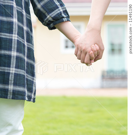 A woman holding hands A woman holding hands 11491190