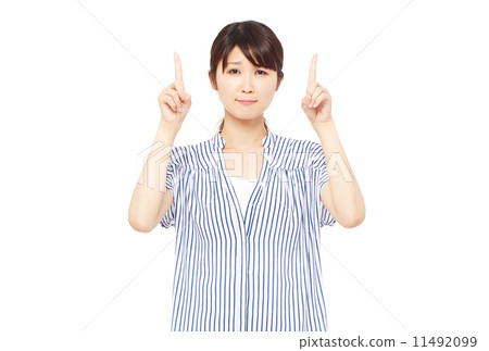 A woman pointing at a troubled face 11492099