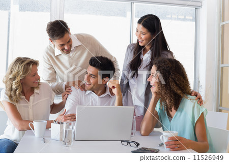 Casual smiling business team congratulating their colleague Casual smiling business team congratulating their colleague 11526949