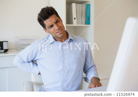 Casual businessman touching his sore back 11526974