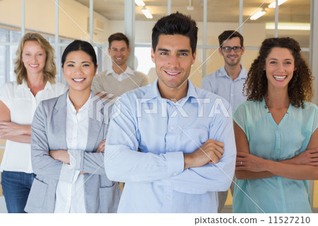 Casual business team smiling at camera with arms crossed 11527210