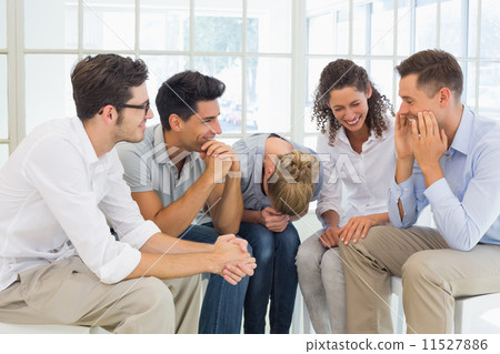 Group therapy in session sitting in a circle 11527886