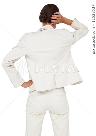 Thinking businesswoman with hand on head 11528537