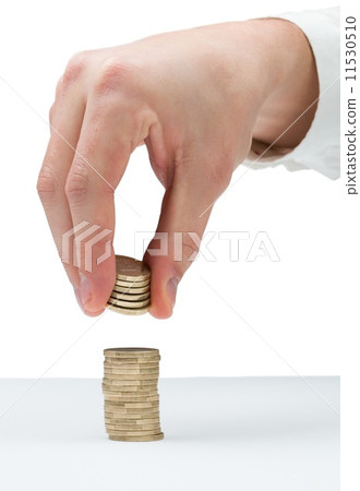 Businessman counting his coins at desk 11530510
