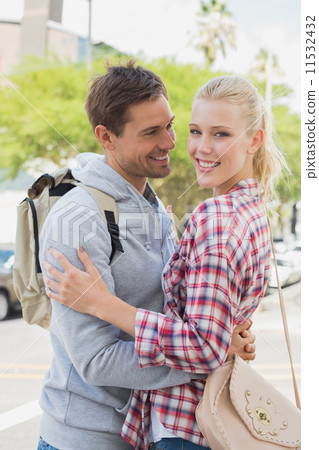 Young tourist couple hugging each other Young tourist couple hugging each other 11532432