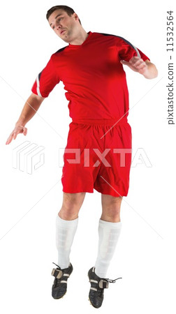 Football player in red jumping Football player in red jumping 11532564