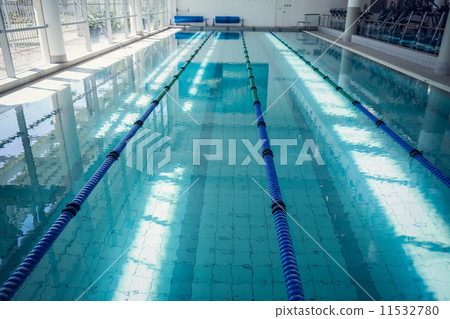 Large swimming pool with sunlight streaming in Large swimming pool with sunlight streaming in 11532780
