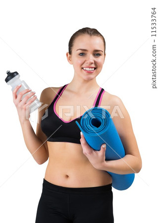 Fit brunette holding mat and sports bottle Fit brunette holding mat and sports bottle 11533764
