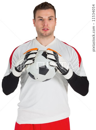 Goalkeeper in white holding ball Goalkeeper in white holding ball 11534054