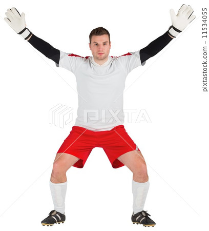 Goalkeeper in white ready to save Goalkeeper in white ready to save 11534055