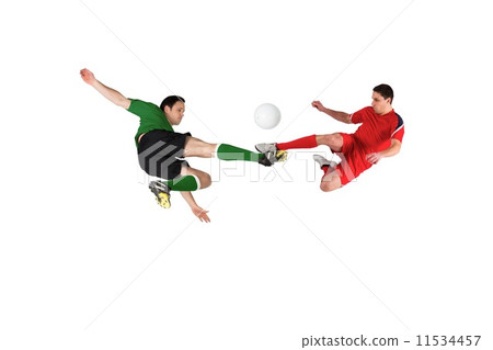 Football players tackling for the ball Football players tackling for the ball 11534457
