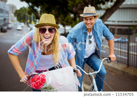Hip young couple going for a bike ride Hip young couple going for a bike ride 11534705