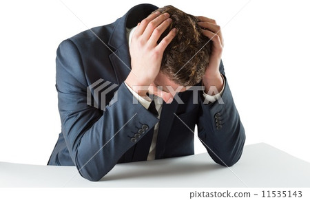 Businessman with head in hands 11535143