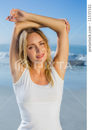 Gorgeous happy blonde posing at the beach 11535581