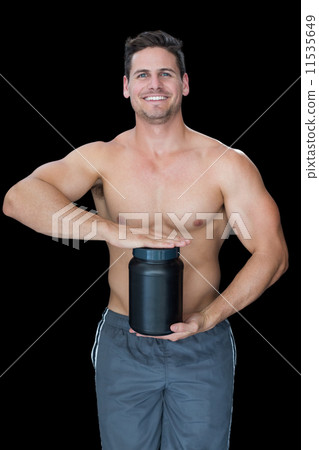 Muscular man posing with nutritional supplement Muscular man posing with nutritional supplement 11535649
