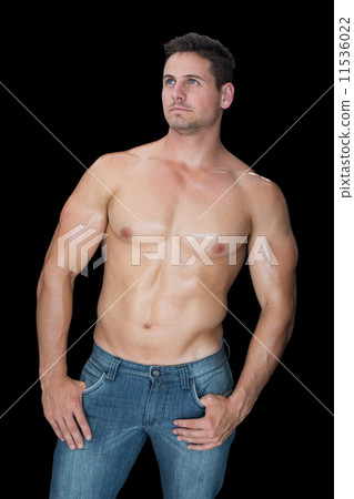 Muscular man posing in blue jeans Muscular man posing in blue jeans 11536022