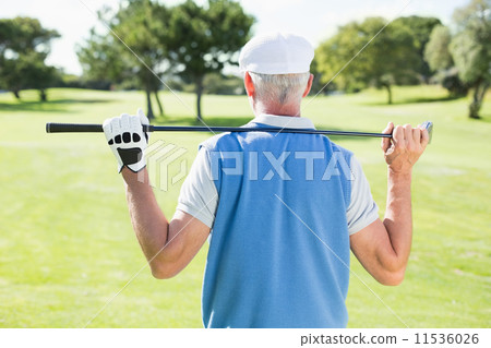 Golfer holding his club behind his head Golfer holding his club behind his head 11536026
