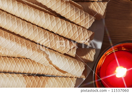Luxury wafers with shiny burning candle Luxury wafers with shiny burning candle 11537060