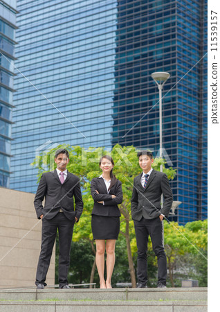 Three young, multi-ethnic and confident co-workers standing in front of building Three young, multi-ethnic and confident co-workers standing in front of building 11539157
