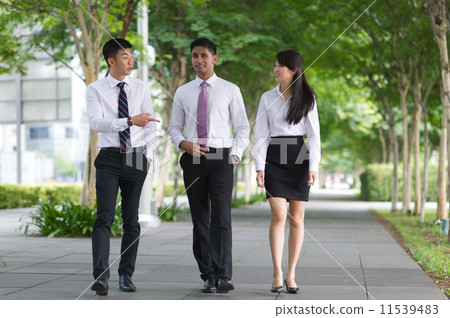 Three young, dynamic and multi-ethnic colleagues having a good time talking among themselves Three young, dynamic and multi-ethnic colleagues having a good time talking among themselves 11539483