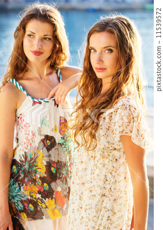 Two beautiful young women having fun in the city 11539572