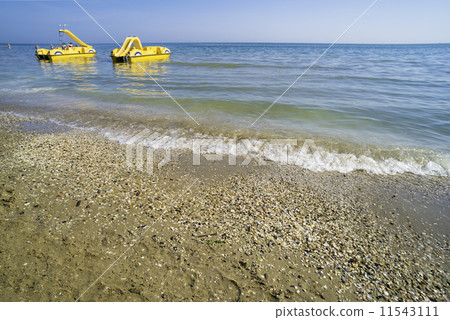 Yellow lifeboat on the beach. 11543111