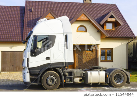 Truck in front of  suburban house 11544044