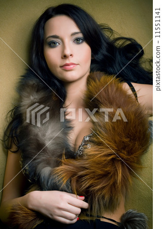attractive glamor girl with brown boa 11551141