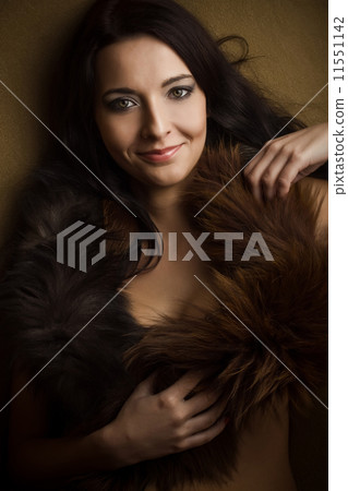 attractive glamor girl with brown boa 11551142