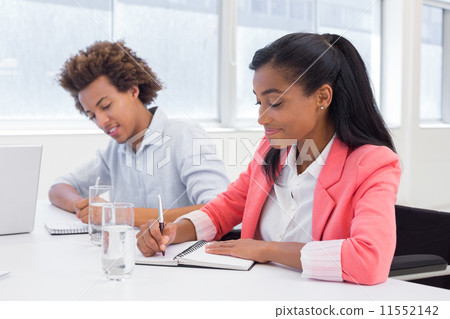 Attractive business people working hard on plans 11552142