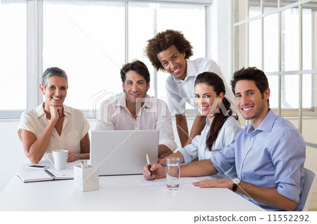 Attractive business people smiling in the workplace 11552292