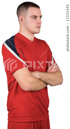 Fit football player standing with arms crossed Fit football player standing with arms crossed 11552445