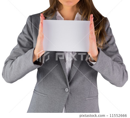 Businesswoman showing a blank card 11552666