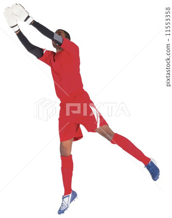 Goalkeeper in red making a save Goalkeeper in red making a save 11553358