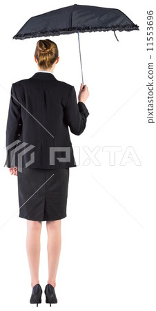 Businesswoman holding a black umbrella 11553696