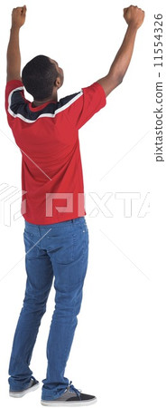 Excited handsome football fan cheering Excited handsome football fan cheering 11554326