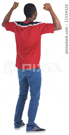 Excited handsome football fan cheering Excited handsome football fan cheering 11554328