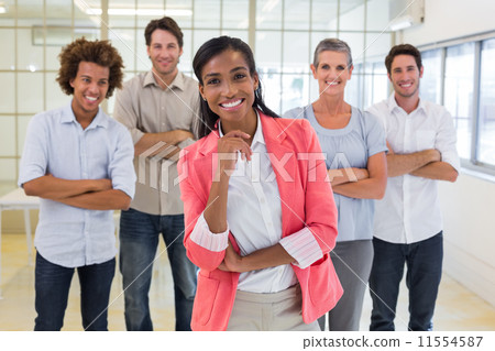 Well dressed workers with arms folded smiling at camera 11554587