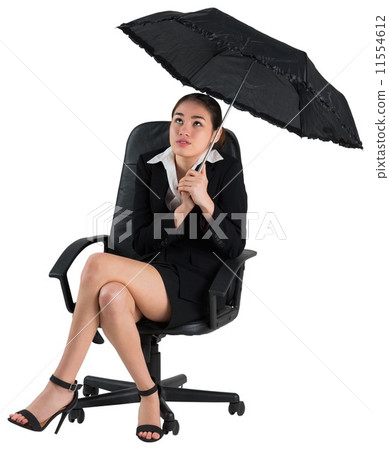 Young businesswoman holding umbrella Young businesswoman holding umbrella 11554612