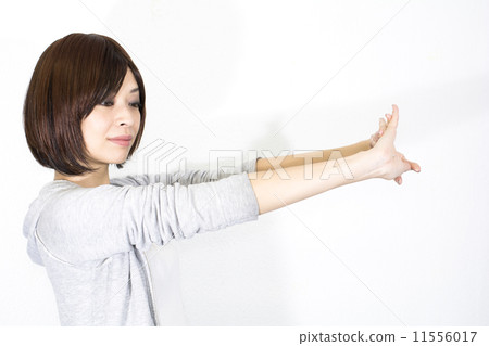 A woman stretching out her arms 11556017